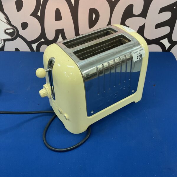 Front view of a vintage Dualit Classic stainless steel toaster.