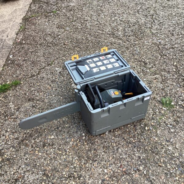 Ryobi chainsaw in a black carry case, garden tool.