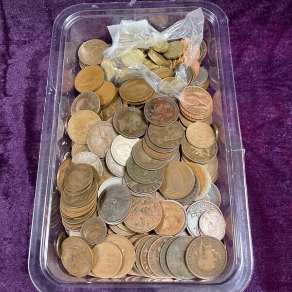 Tray of assorted British pennies and threepenny coins for collectors.