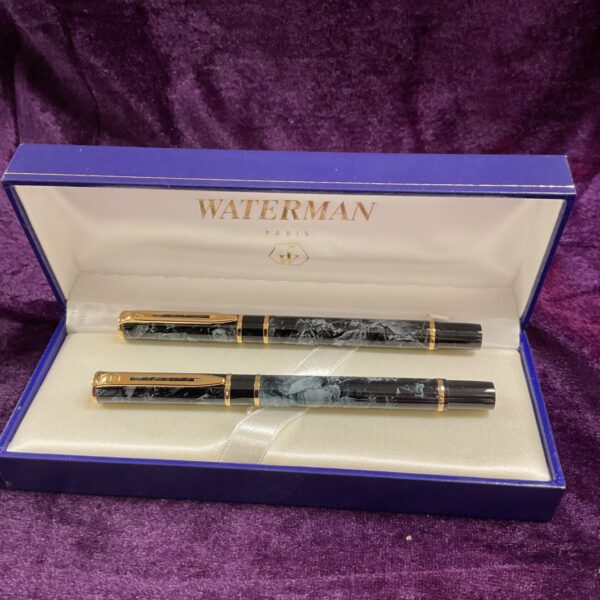 Waterman grey marbled fountain and ballpoint pen set displayed.