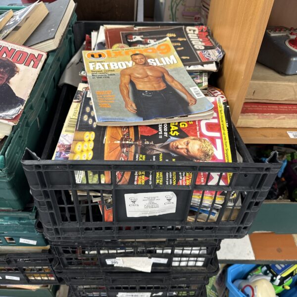 Stack of music magazines and books in crates, a collector's lot.
