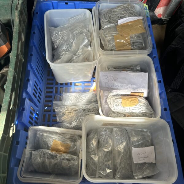 Assorted nails and tacks in tubs, a DIY hardware lot.