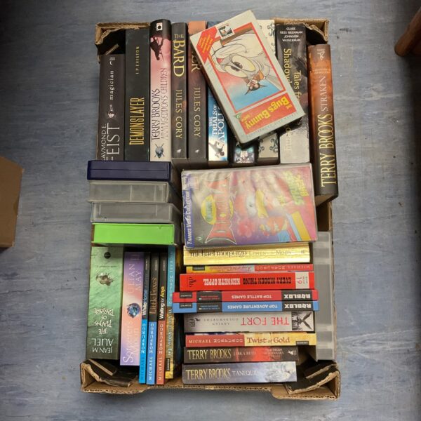 Terry Brooks books and vintage VHS tapes including Bug Bunny.