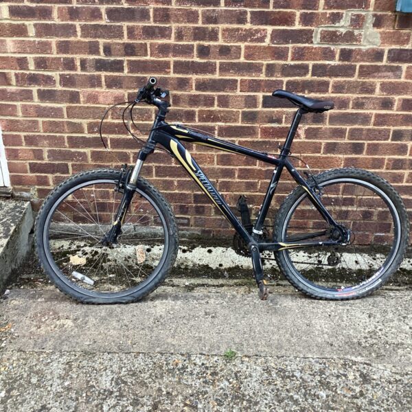 Blue and silver Specialized Hardrock mountain bike for repair.