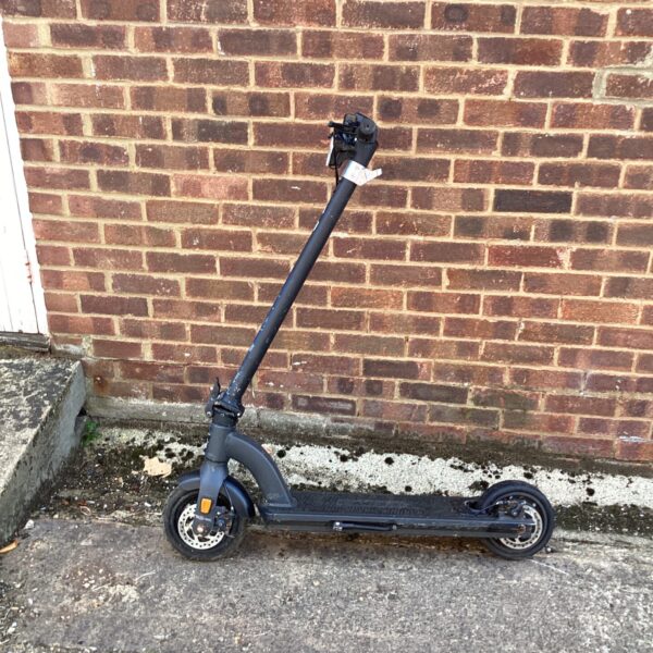 Foldable Imoral electric scooter needing repair for urban transport.