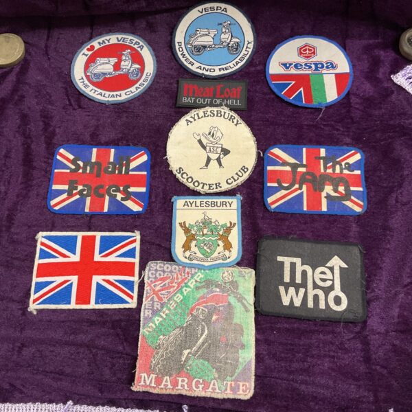 Vintage Vespa and scooter enamel badges collection.