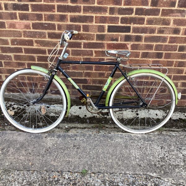 Side view of a vintage Raleigh bicycle with mudguards.