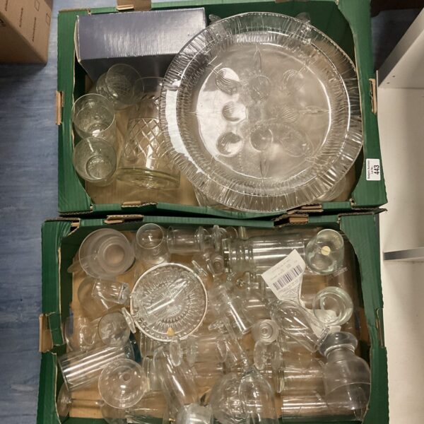 Assorted vintage glassware lot with various glasses and decorative pieces.