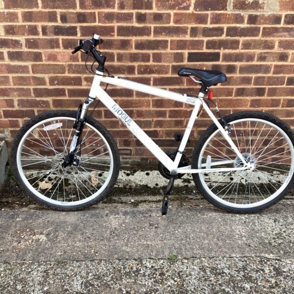 Side view of a used Apollo Mogul mountain bike.