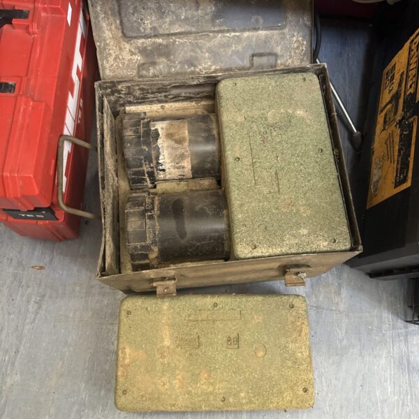 Vintage metal ammo tin with shell tubes inside.