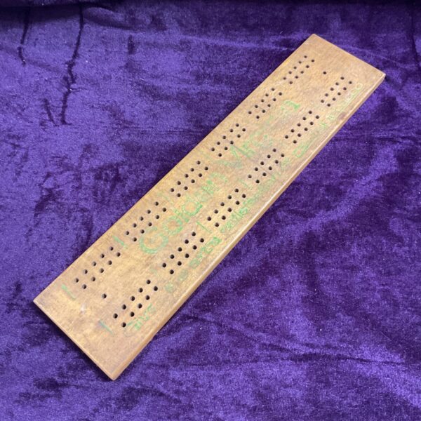 Vintage Golden Virginia cribbage board with wooden track and peg holes.