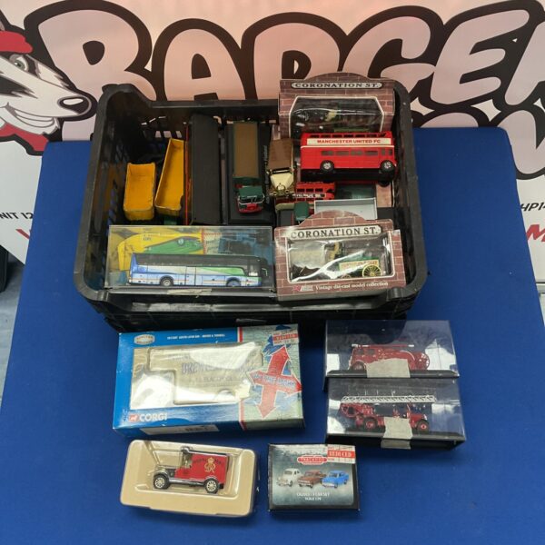 Diecast model cars lot featuring Manchester United bus and Coronation Street vehicles.