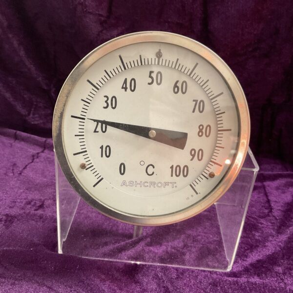 Vintage Ashcroft industrial thermometer displaying temperature scale.
