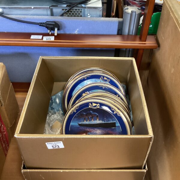 Set of vintage Titanic commemorative plates for wall display.