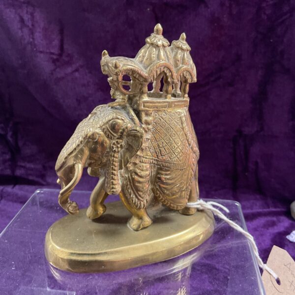 Antique Indian brass elephant figurine with howdah and mahout.