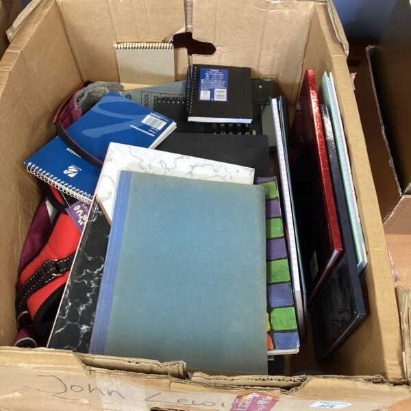 Mixed stationery lot with writing books and calculator for school or office.
