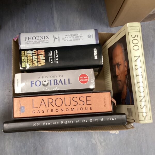 Vintage Larousse encyclopedias stacked, a collection of reference books.