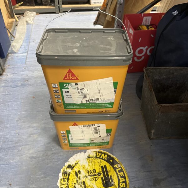 Two tubs of Sika All Weather Jointing Compound for outdoor projects.