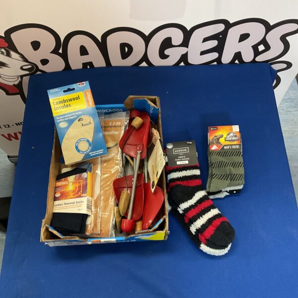 Mixed lot of socks and insoles for footwear comfort.