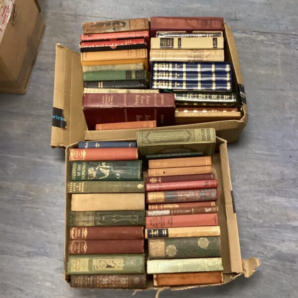 Stack of vintage books including Pride and Prejudice.