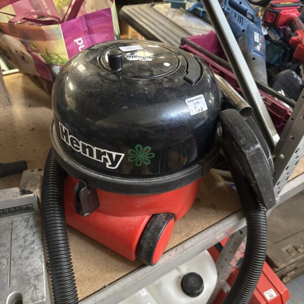 Red Numatic Henry cylinder vacuum cleaner for sale.