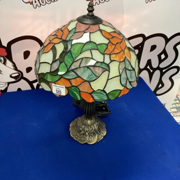 Vibrant stained glass Tiffany style table lamp with colourful mosaic pattern.
