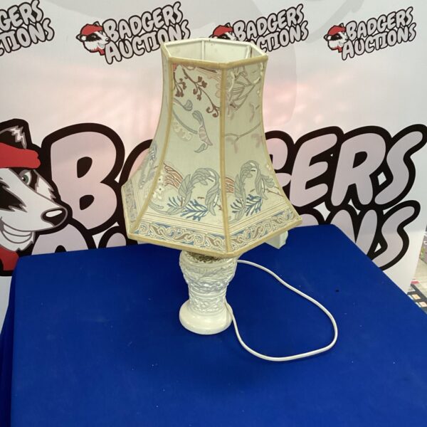 Vintage ornate table lamp with floral ceramic base.