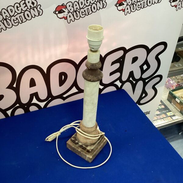 Vintage marble column lamp with cream lampshade for home decor.