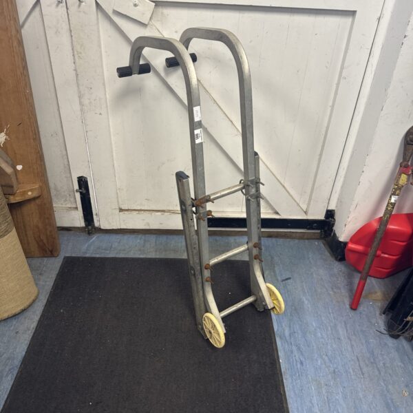 Vintage metal ladder roof stay for roof access.