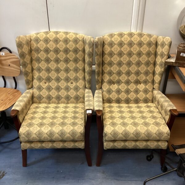 Patterned wingback chair pair, vintage upholstered seating.