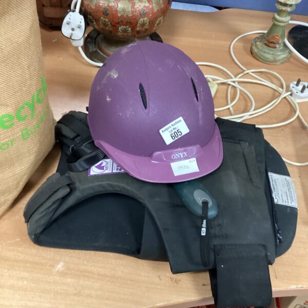 Equestrian riding hat and body protector set for horse riding safety.