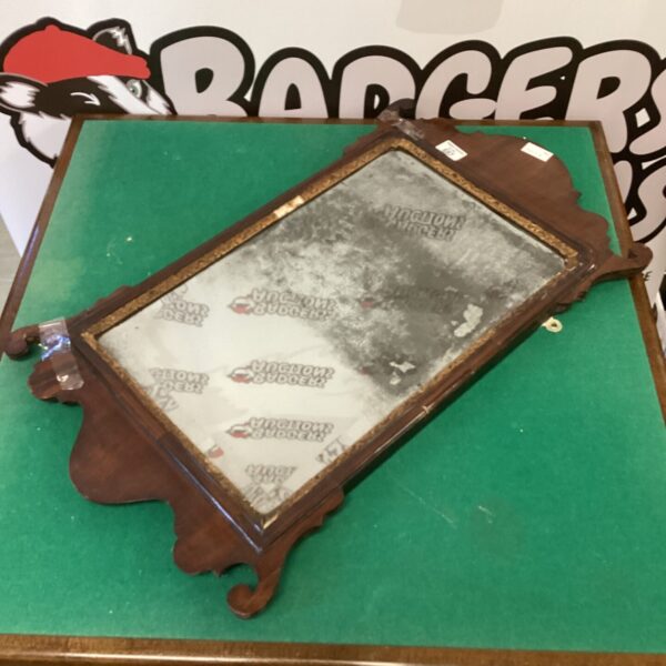 Antique George II walnut mirror with fretwork detailing.