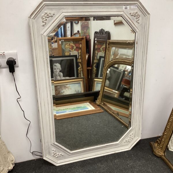 Ornate French style distressed mirror for vintage home decor.