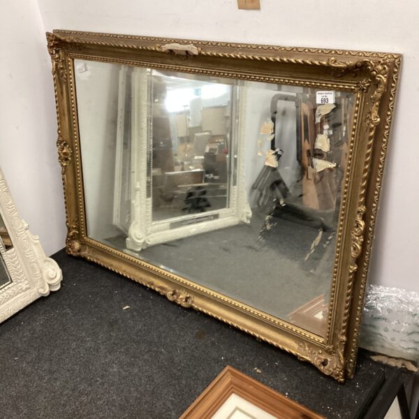 Ornate 19th-century gilt framed mirror awaiting restoration.