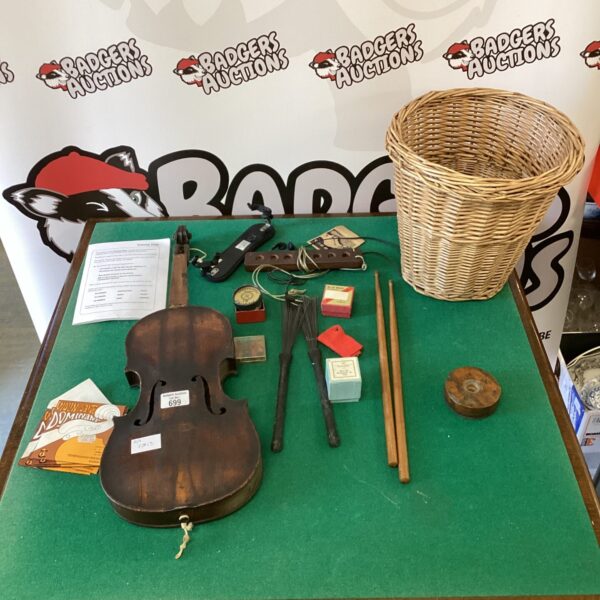 Vintage musical instrument lot in a wicker basket.