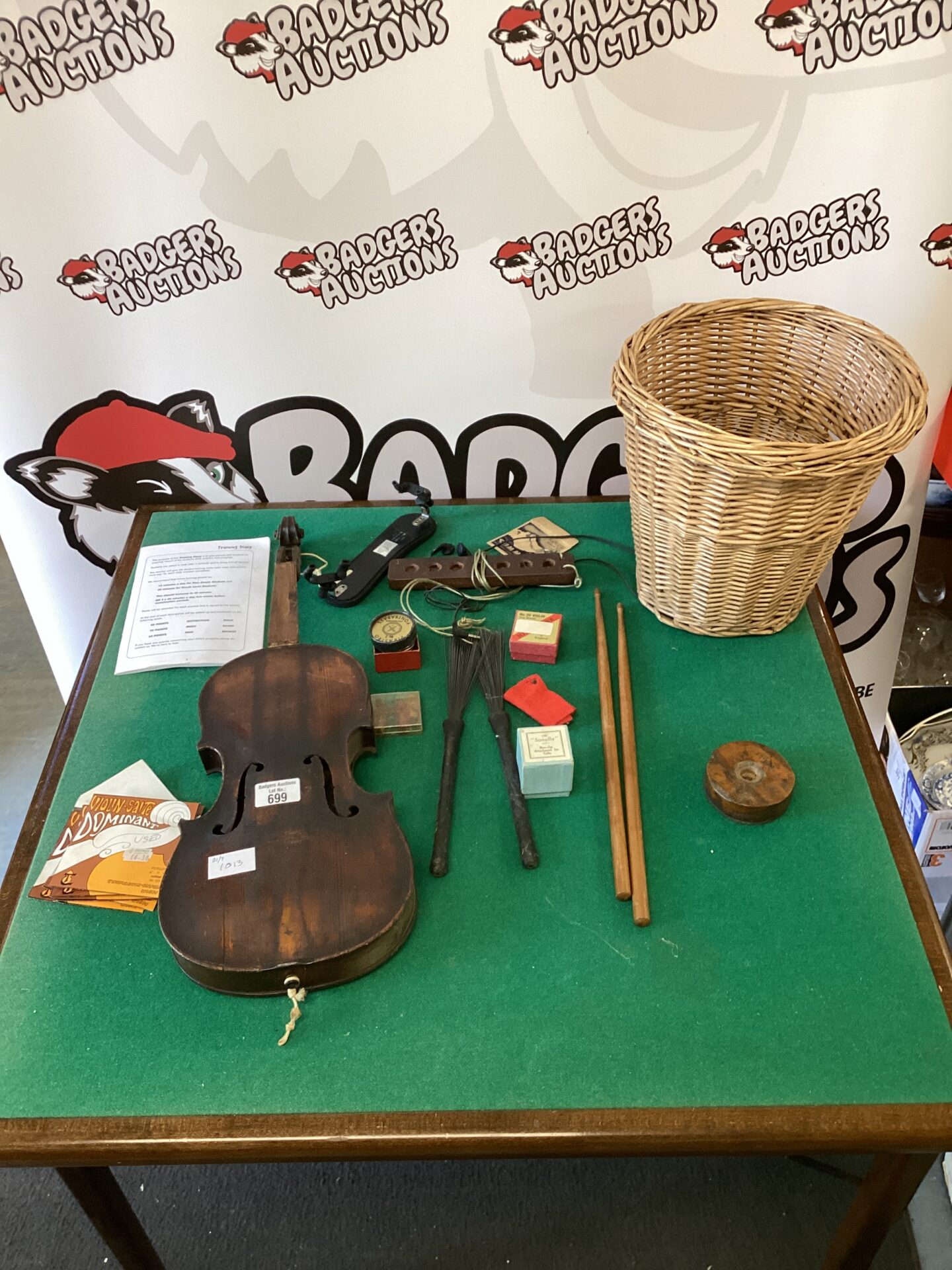 699 Wicker basket of mixed inc vintage violin, drum sticks & other items