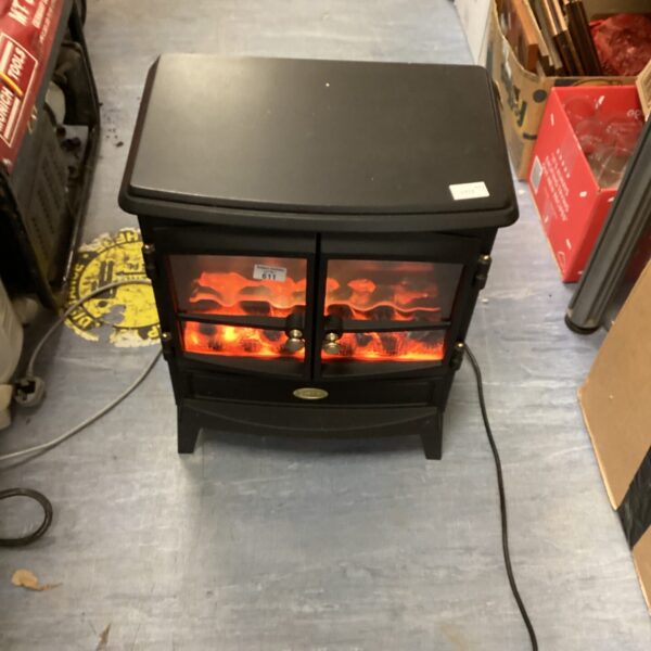 Front view of a vintage Dimplex electric stove with flame effect.
