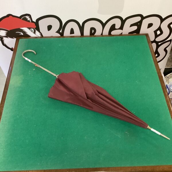 Vintage amber stone umbrella with white metal handle.