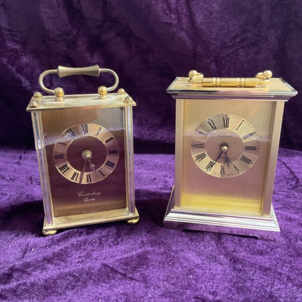 Vintage brass quartz mantle clock with Roman numerals.