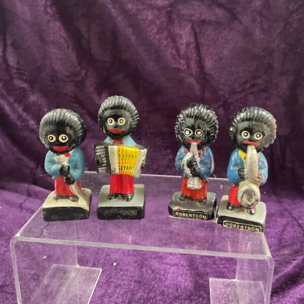 Vintage Robertson Golly figure playing an accordion, collectible toy.