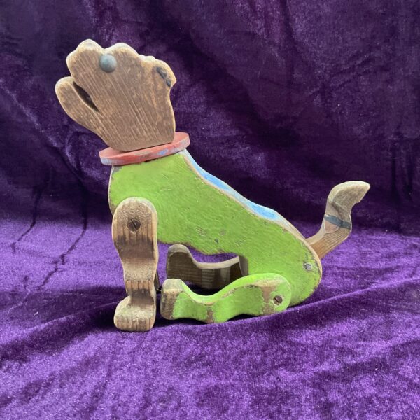 Colourful vintage wooden bulldog toy, antique collectible.