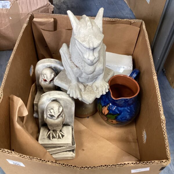 Handcrafted pottery collection with a glazed vase and ceramic pieces.