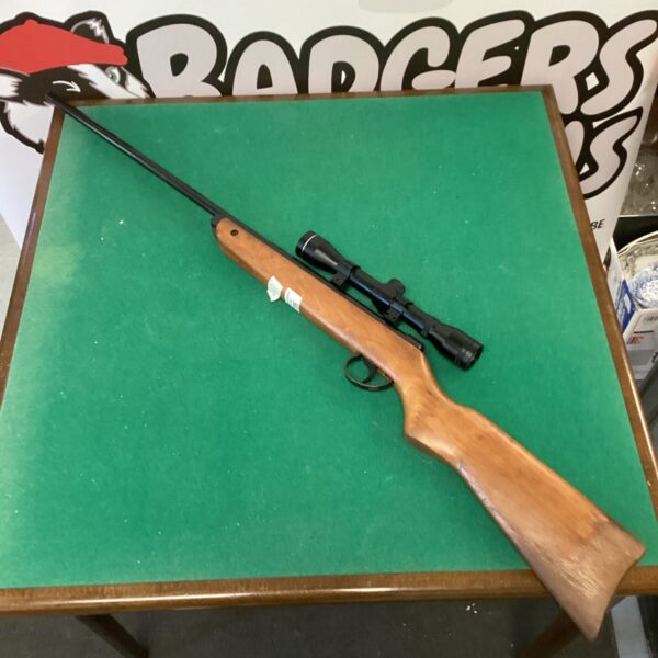 Vintage BSA Meteor air rifle with scope attached.