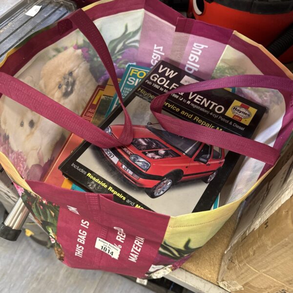 Collection of vintage Haynes manuals for VW Golf and Vento repair.