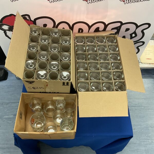 Mixed glassware lot in cardboard boxes, assorted drinking glasses.