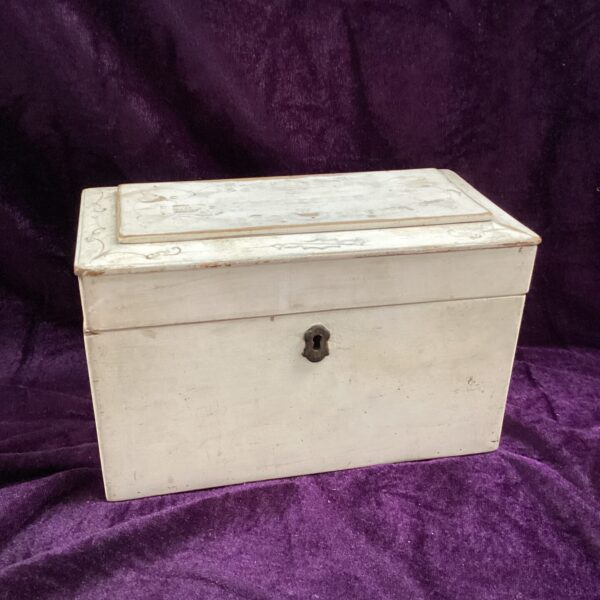 Antique white stationary box with keyhole detail.