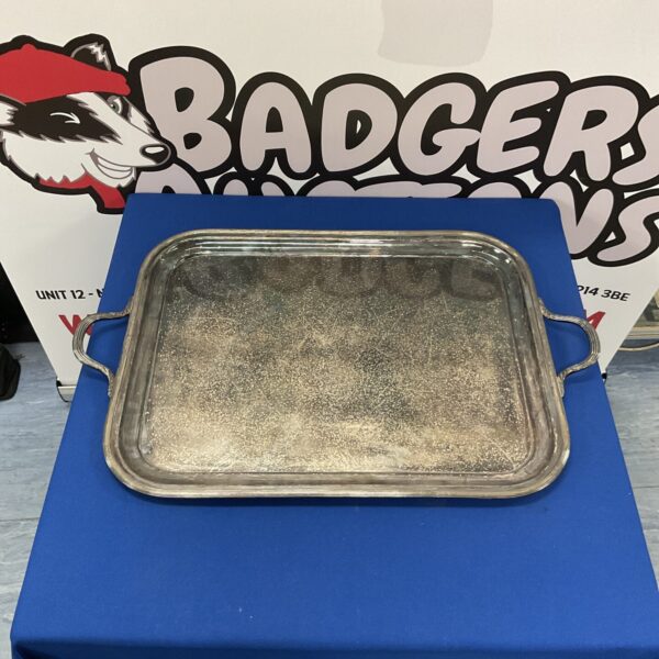 Large silverplate serving tray with ornate gallery edge.