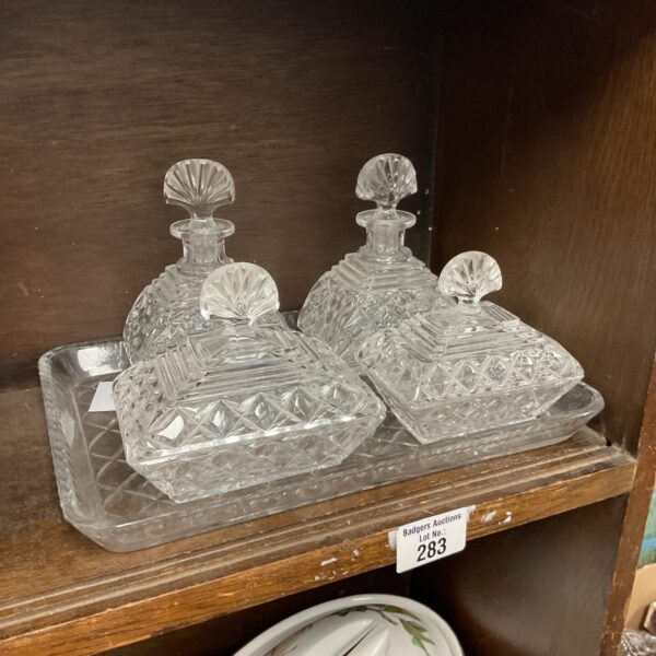 Vintage Art Deco cut glass vanity set with tray and bottles.