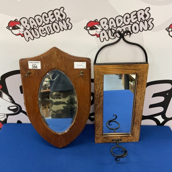 Vintage hall mirror with bevelled edge and wooden frame.