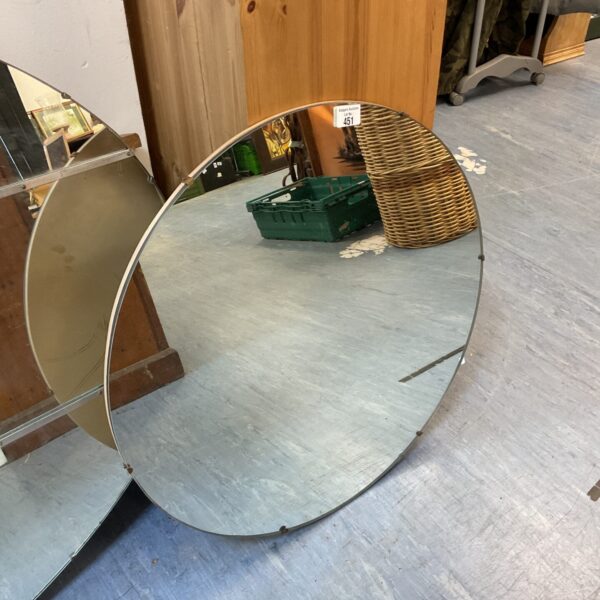 Vintage round wall mirror with beveled edge, ideal for home decor.